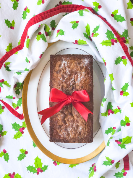 cranberry bread with red bow on holly berry tablecloth