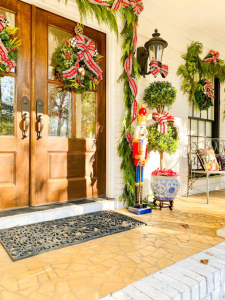 front doors with topiary and wreaths