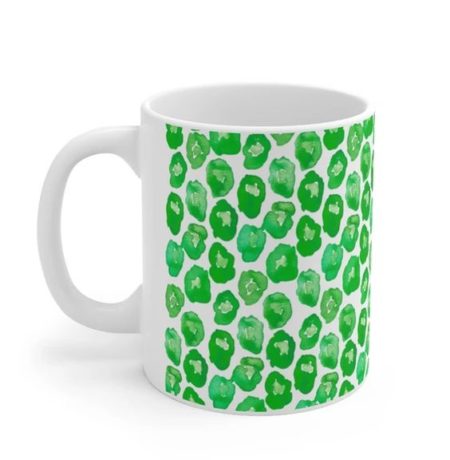 white coffee mug with green leopard spot print