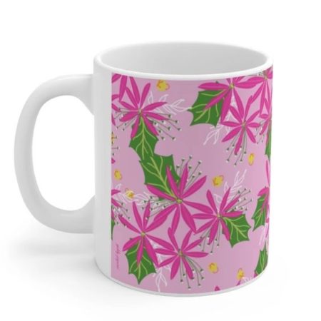 pink poinsettia mug with green leaves and gold jingle bells