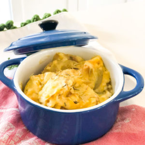 potato au gratin in blue le crueset pot