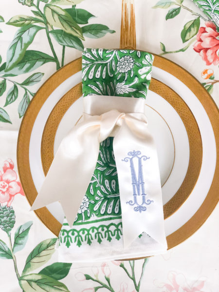 monogrammed napkin twilly ribbon on floral napkin and floral tablecloth