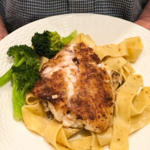 snapper piccata on whote plate with broccoli side