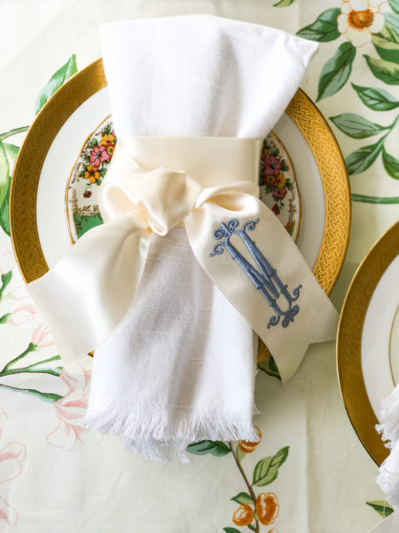 napkin twilly monogrammed in blue tied on a white napkin