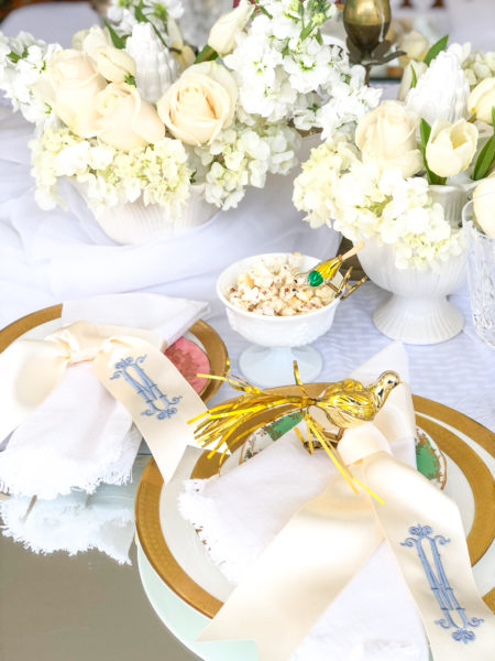 winter white tablescape with flowers and birds