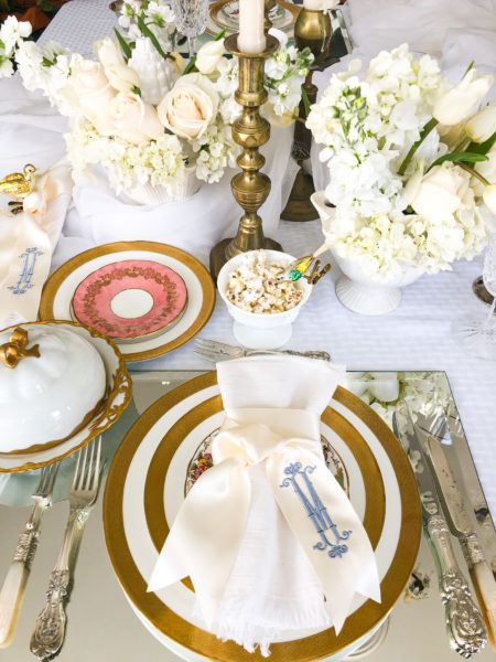 winter table setting with gold silver mirrors and flowers