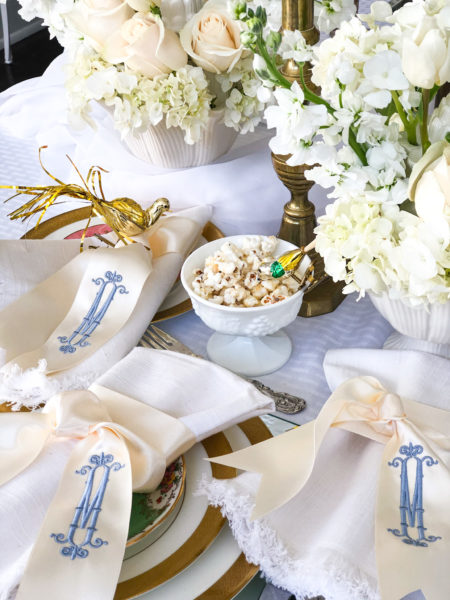 winter white table with ribbon monograms and popcorn with bird ornaments