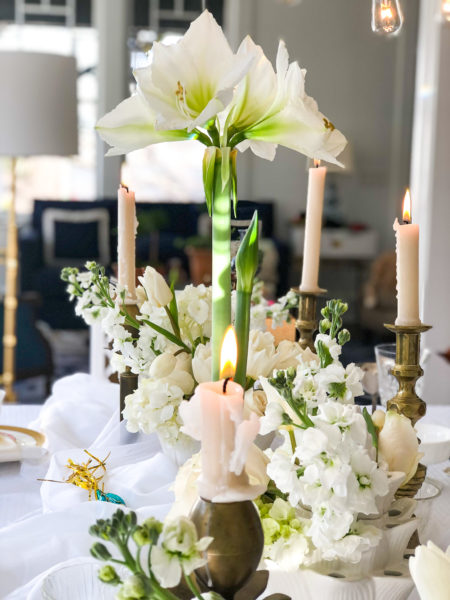 winter white table with candles and amaryllis