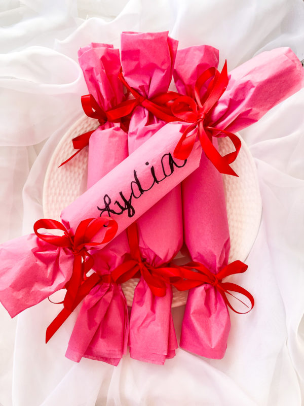 british party crackers pink with red double bows and lydia written on one