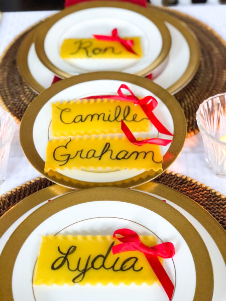 lasagna pasta with name written and bow tied to use as place card