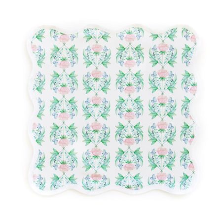square scalloped placemat with pink flowers and green leaves