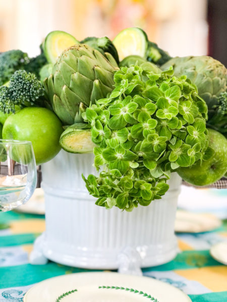 green floral centerpiece using hydrangeas and vegetables