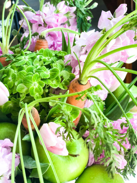 close up of easter flower arrangement with carrots