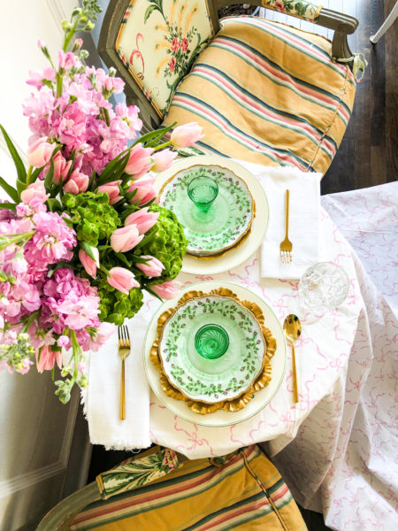 overhead view of table set with pink green and yellow