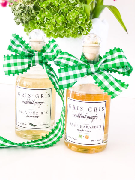 gris gris magic cocktail simple syrup with green and white gingham bows on bottles