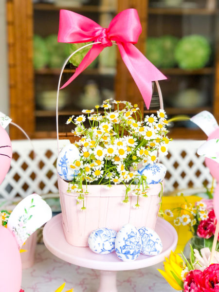 kids easter table setting ideas chamomile in pink basket centerpiece