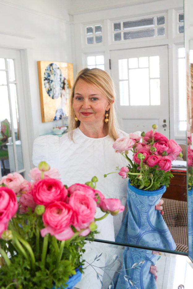 lydia menzies holding bouquet of pink ranunculus
