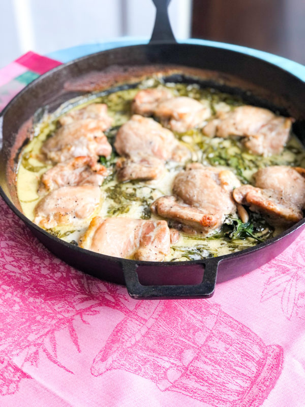lemon chicken with spinach in cast iron skillet