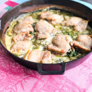 lemon chicken with spinach in cast iron skillet