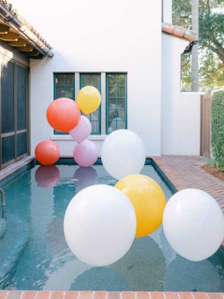 balloon installation in pool for citrus party