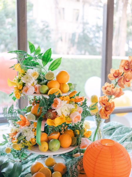 citrus party floral arrangement on porch
