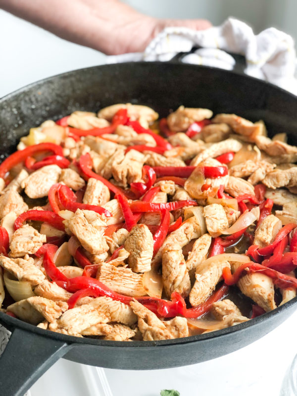 chicken-fajitas-with-onions-and-peppers-in-cast-iron-skiller