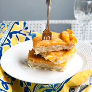 cheesy chicken enchiladas cut into slices with fork at top