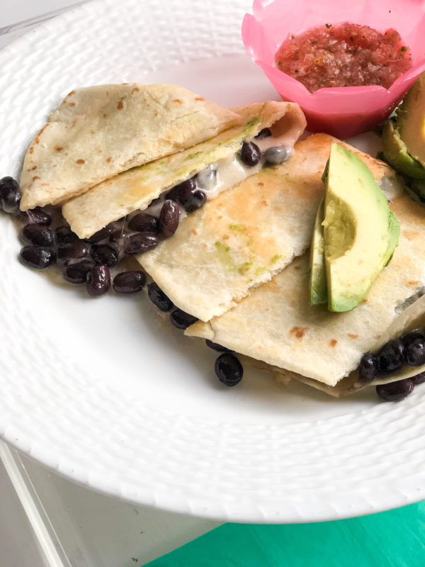 quesadilla with cheese black beans with salsa on the side and avocado slices