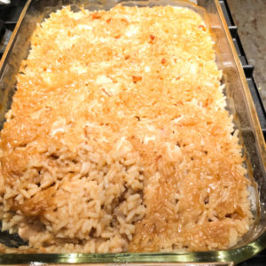 chicken and rice casserole in glass pan