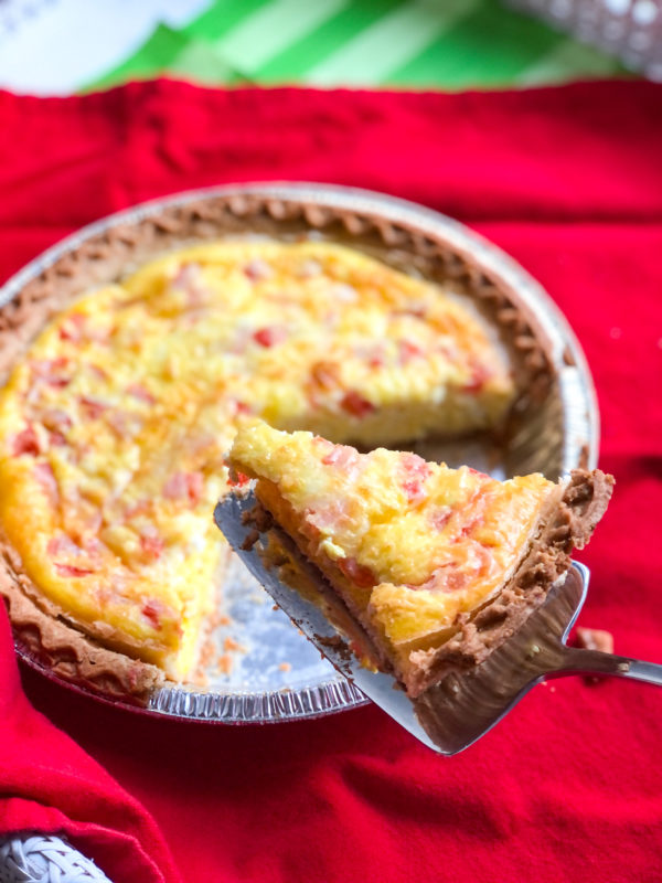 quiche with one slice lifted up
