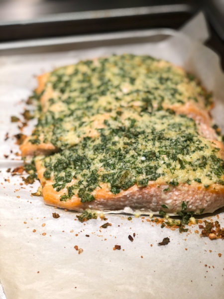 salmon with parsley and cheese on top