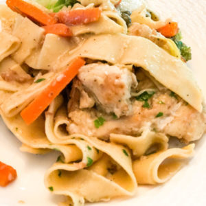 chicken piccata with egg noodles carrots and broccoli