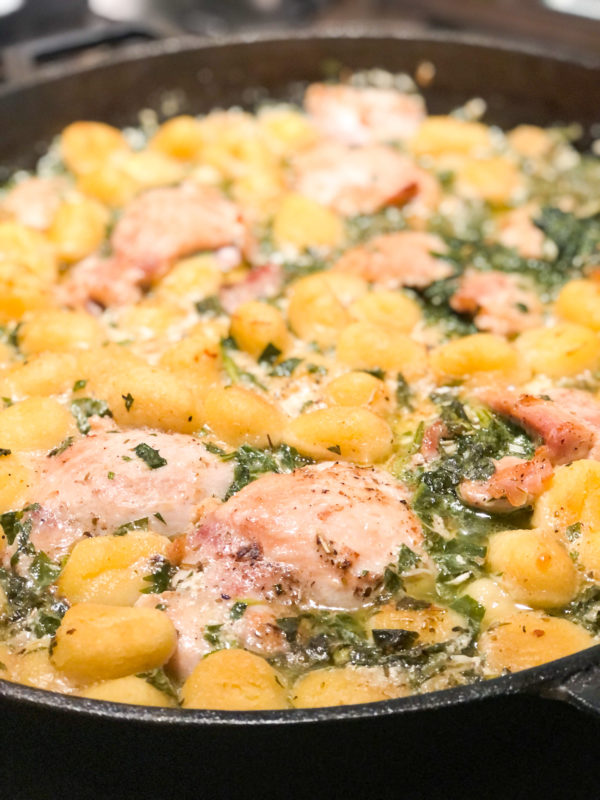 close up photo of chicken gnocchi and spinach