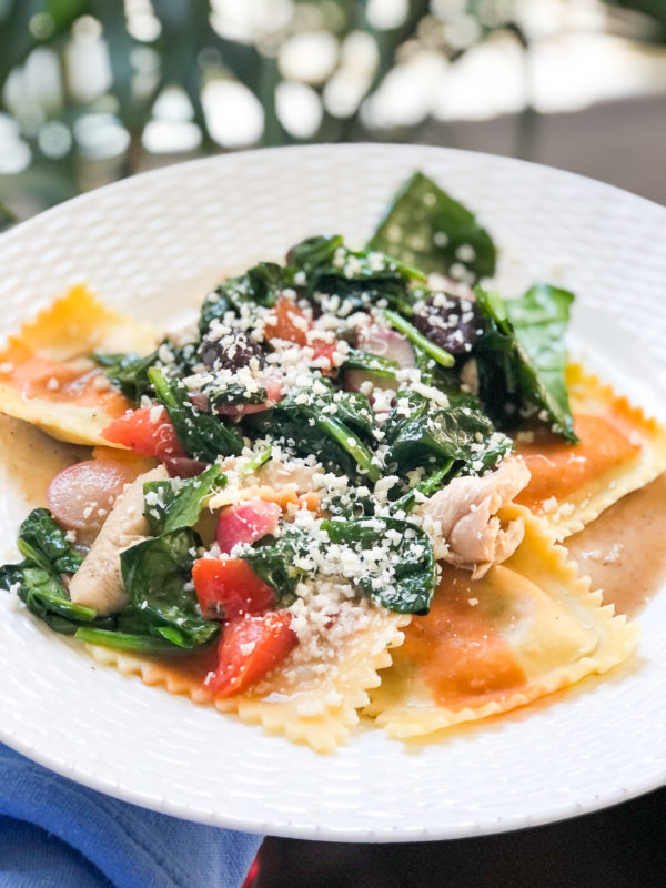ravioli with spinach and tomatoes and cheese