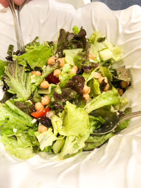 greek salad with chickpeas in large white bowl