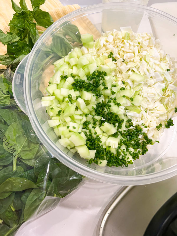 green salad with cabbage cucumbers and chives