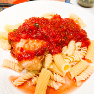 chicken with marinara sauce served over penne pasta