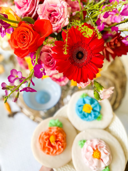 colorful flowers surrounded by colorful flower cookies