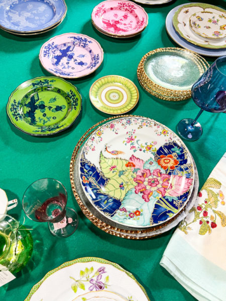 colorful plates on a green table