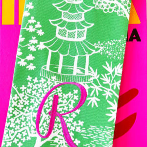 green pagoda tea towel with pink monogram R