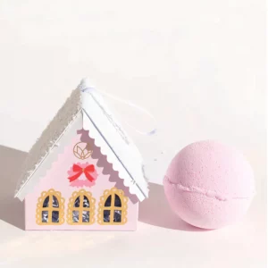 Pink gingerbread house box with pink bath bomb