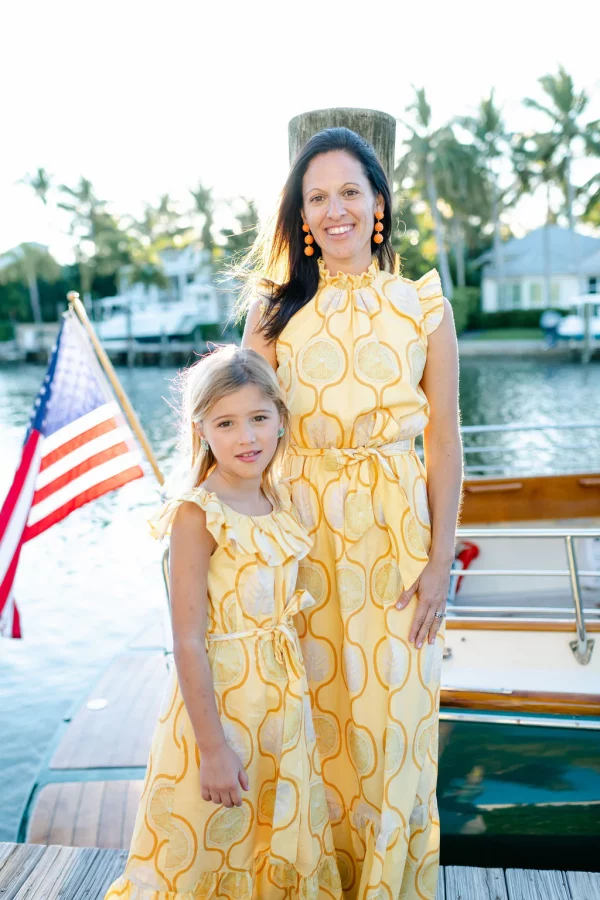 mom daughter in matching dresses with yellow lemon print