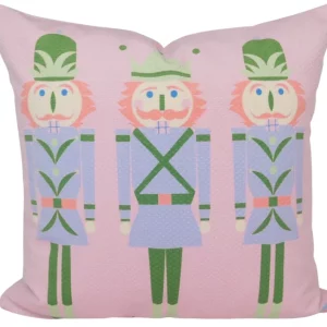 pink pillow with 3 nutcrackers wearing blue