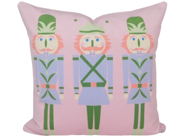 pink pillow with 3 nutcrackers wearing blue