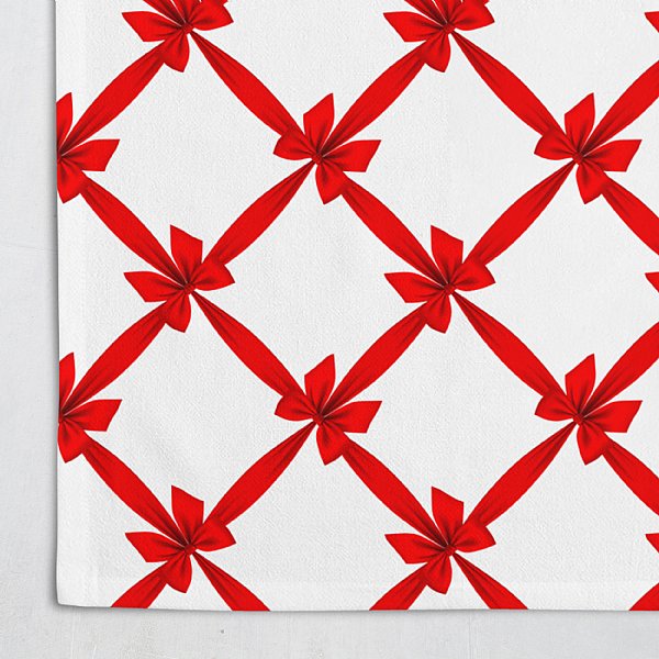 white table cloth with red bows making a crisscross pattern
