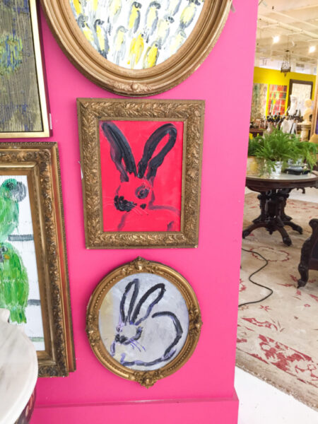 hunt slonem's bunny art in red and silver on hot pink wall