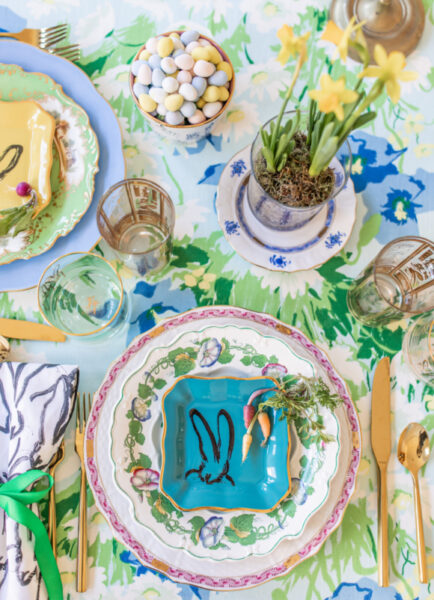 table set with floral tablecloth and hunt slonem bunny plates