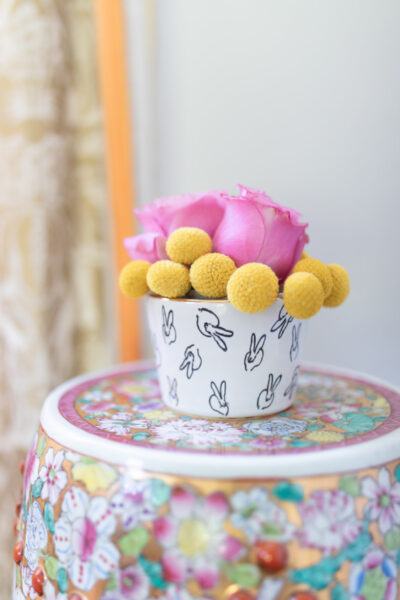 bunny bowl with flowers on a colorful garden stool