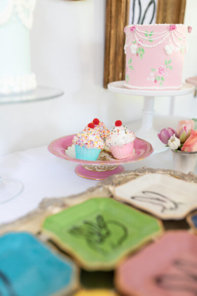 cake and cupcakes with bunny dessert plates