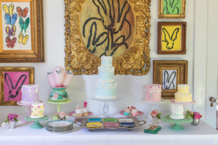cake display set up in front of hunt slonem art display